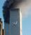 View of Second Plane with Smoke Billowing From North Tower (11.86K)