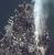 This one-meter resolution satellite image of Manhattan, New York was collected at 11:43 a.m. EDT on Sept. 12, 2001 by Space Imaging's IKONOS satellite. The image shows an area of white and gray-colored dust and smoke at the location where the 1,350-foot towers of the World Trade Center once stood. IKONOS travels 423 miles above the Earth's surface at a speed of 17,500 miles per hour.   Mandatory credit: "spaceimaging.com." Permission is granted to publish in hard copy, broadcast and electronic media, provided proper attribution is given for each and every use. (203.59K)